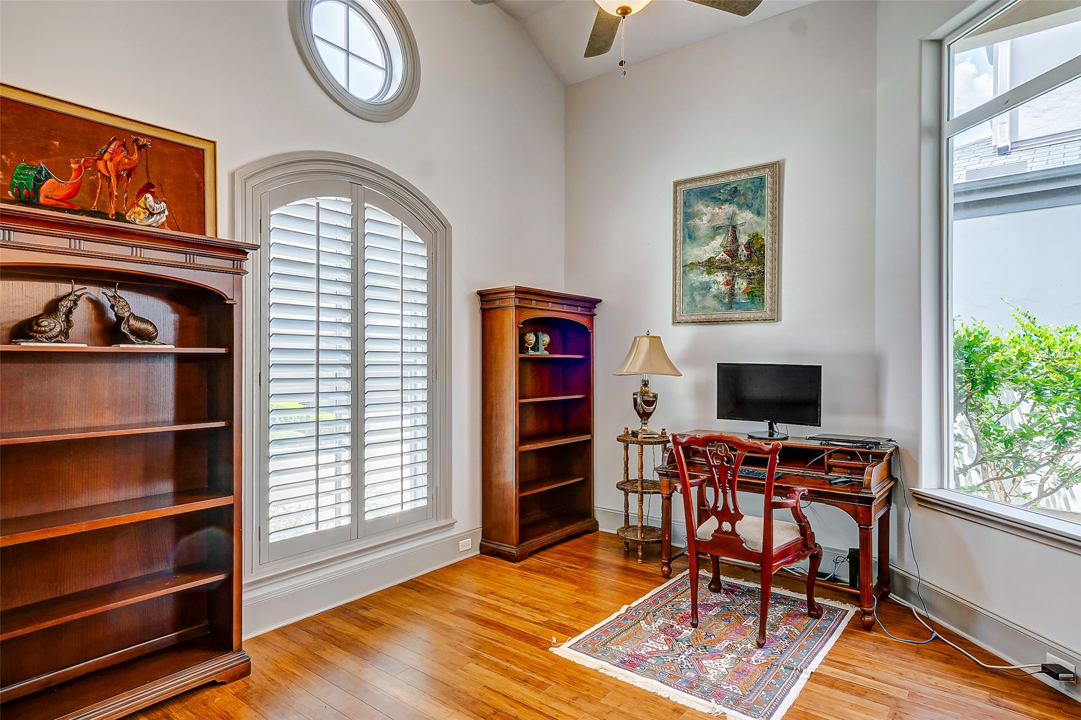 2702 Tudor Manor Houston, TX 77082 - Photo 2 of 25 a view of a workspace with furniture and a window