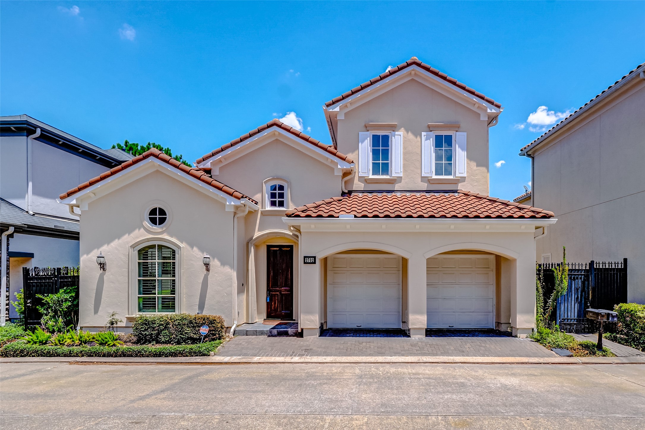 2702 Tudor Manor Houston, TX 77082 - Photo 23 of 25 a front view of a house with garden