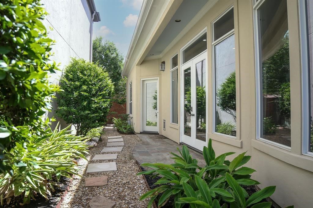 2702 Tudor Manor Houston, TX 77082 - Photo 24 of 25 a view of a pathway with a garden