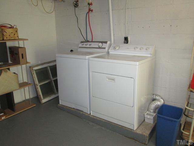 5507 Meadowbrook Road Raleigh, NC 27603 - Photo 11 of 25 The washer and dryer are located in the full basement, which features painted flooring and dry lock on all walls!