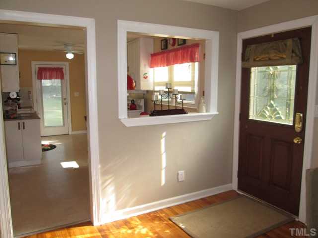 5507 Meadowbrook Road Raleigh, NC 27603 - Photo 12 of 25 The foyer features hardwood floors and opens right into your new home, making it perfect for when your guests arrive and can enter easily without crowding in the entryway!