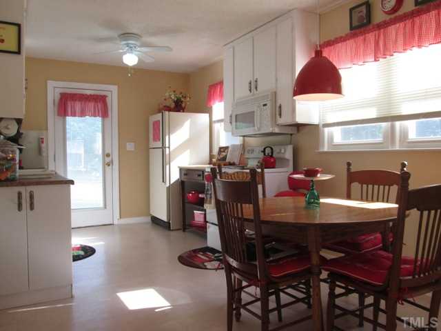 5507 Meadowbrook Road Raleigh, NC 27603 - Photo 20 of 25 The eat-in breakfast area in the kitchen is spacious, nice and bright with natural light, and features built-ins! Serving family and friends a meal is perfect in this space!