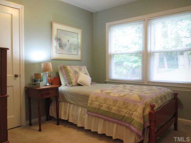 5507 Meadowbrook Road Raleigh, NC 27603 - Photo 24 of 25 This secondary bedroom is nice and bright and features hardwood floors under the carpet!