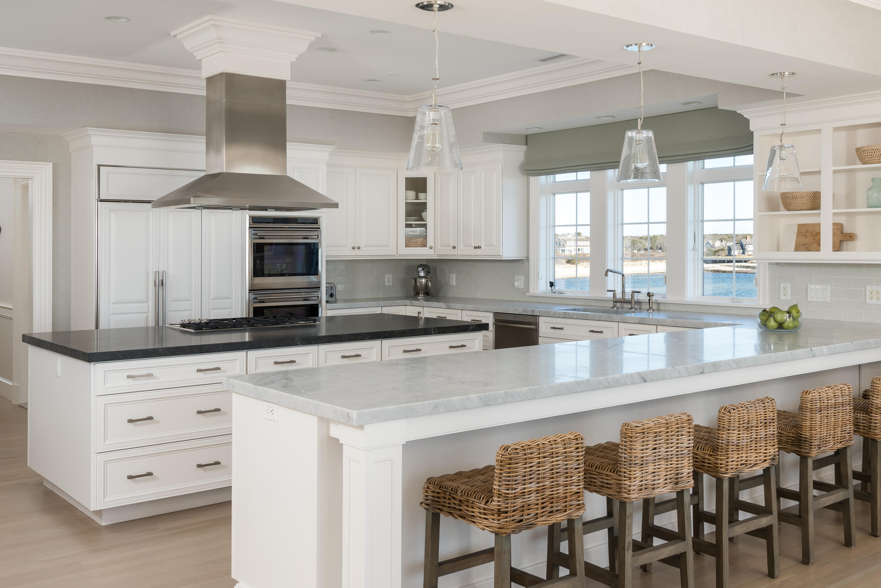 23 Snow Inn Road, Unit 2 Harwich Port, MA 02646 - Photo 19 of 40 a kitchen with granite countertop a sink chairs and cabinets
