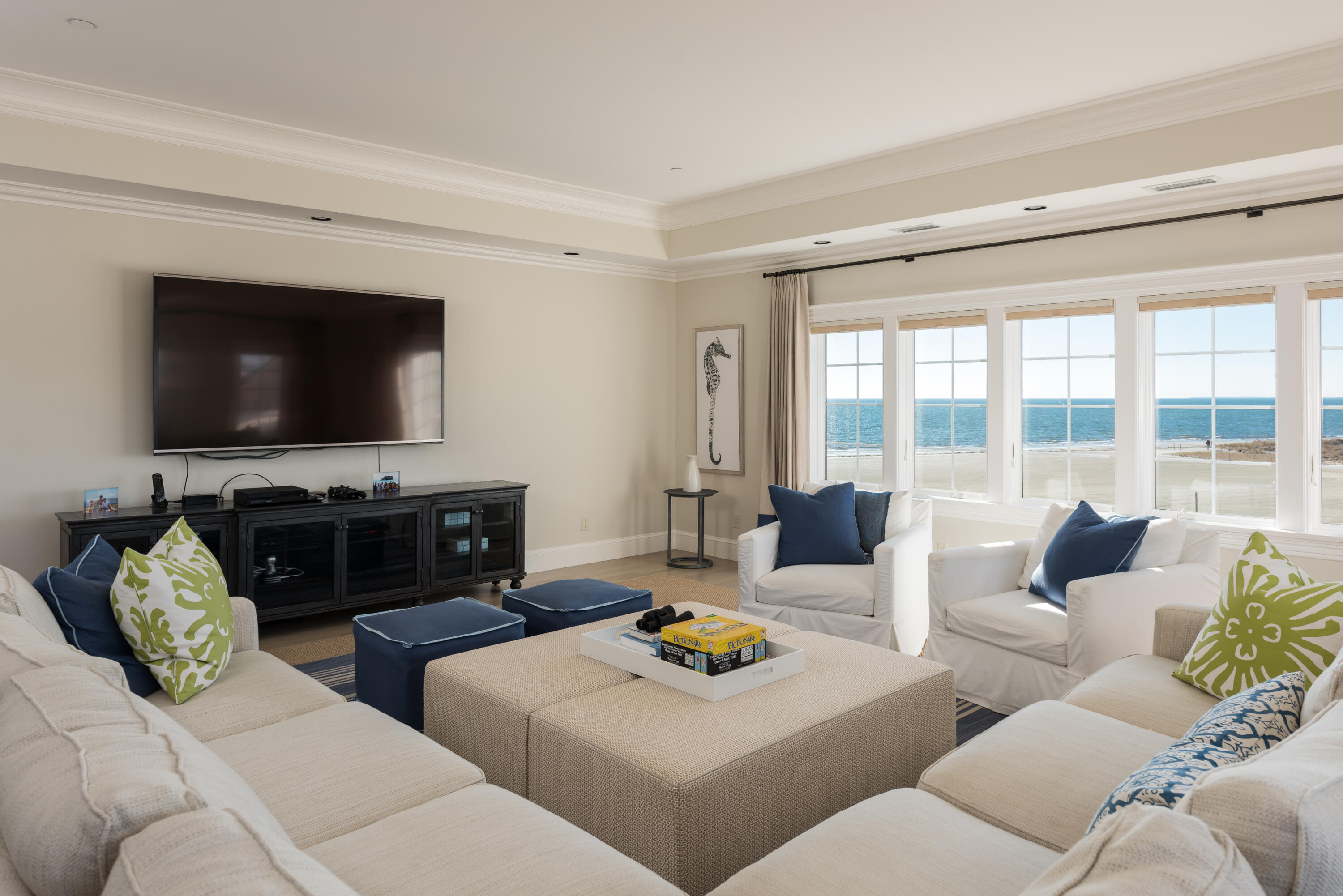 23 Snow Inn Road, Unit 2 Harwich Port, MA 02646 - Photo 21 of 40 a living room with furniture and a flat screen tv