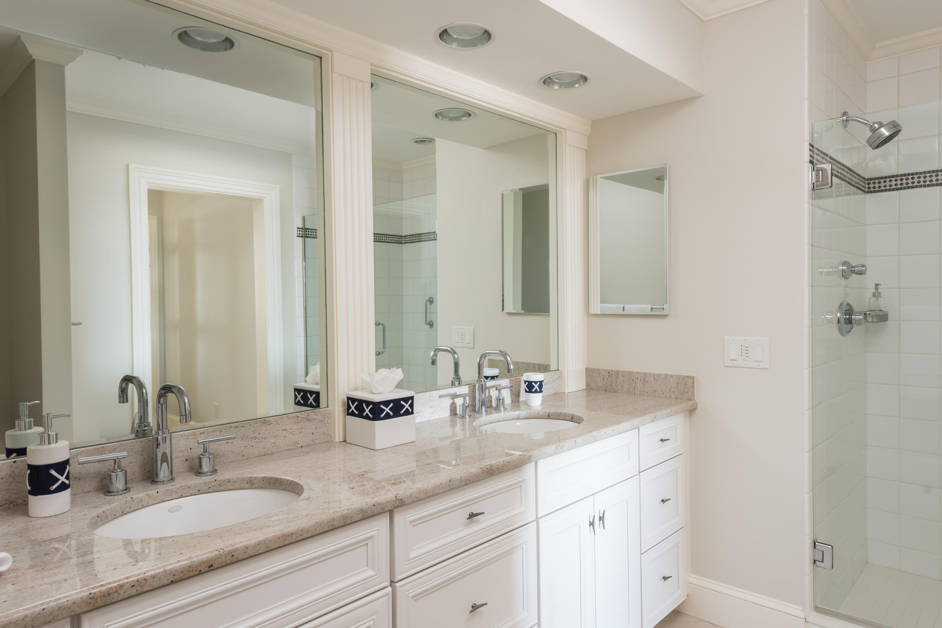 23 Snow Inn Road, Unit 2 Harwich Port, MA 02646 - Photo 31 of 40 a bathroom with double sink and a mirror