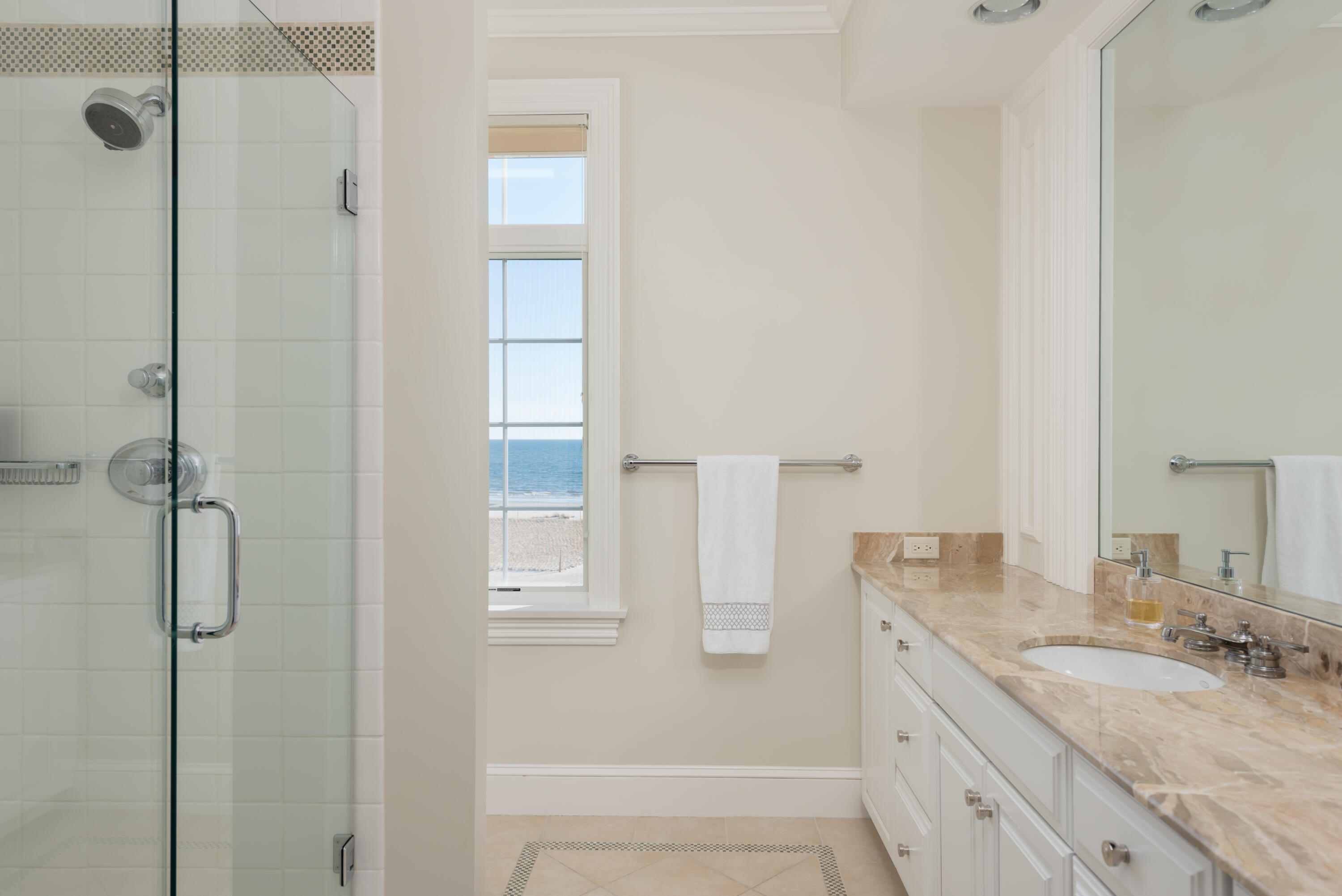23 Snow Inn Road, Unit 2 Harwich Port, MA 02646 - Photo 34 of 40 a bathroom with a granite countertop shower sink vanity and mirror