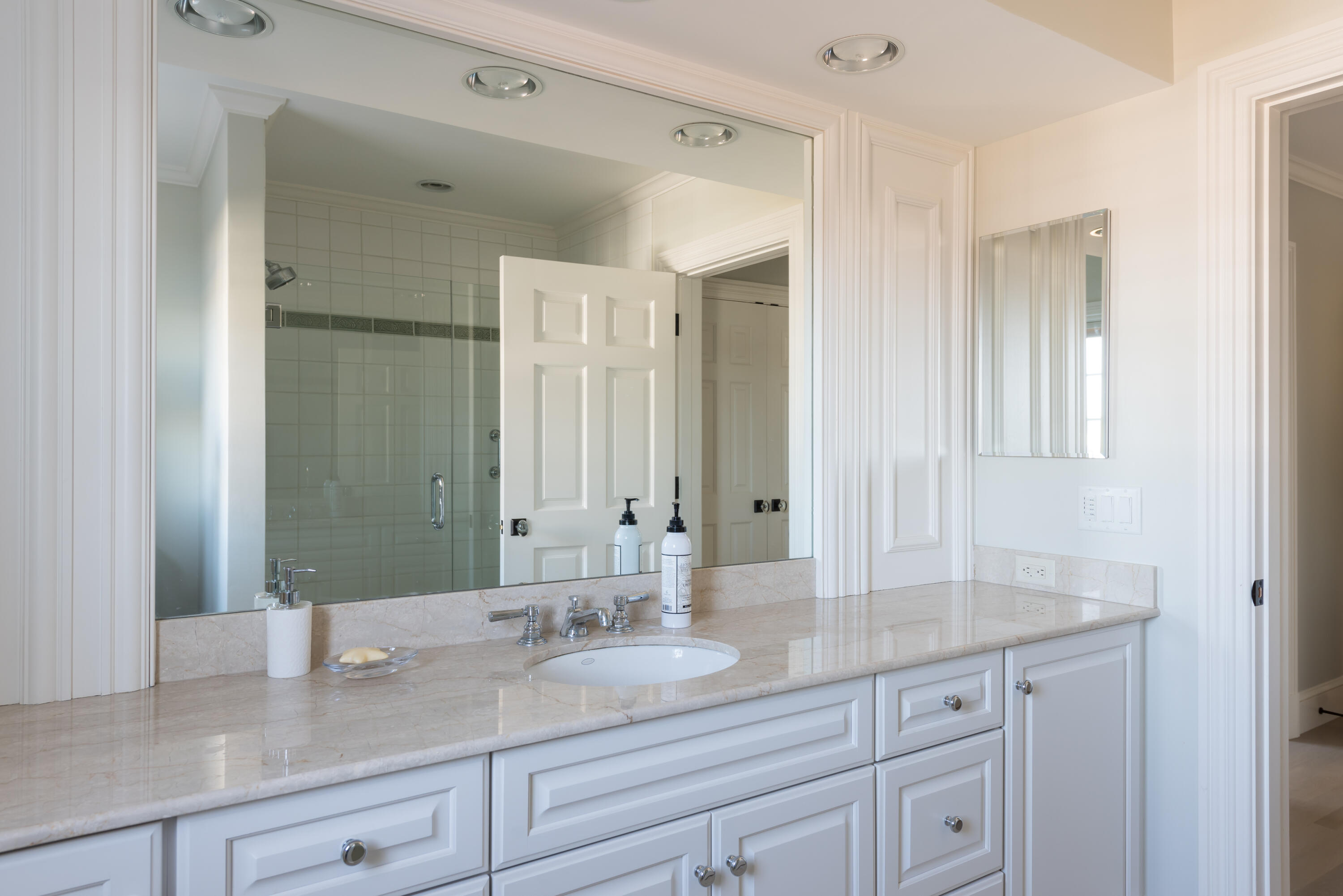 23 Snow Inn Road, Unit 2 Harwich Port, MA 02646 - Photo 35 of 40 a bathroom with a granite countertop sink and a mirror