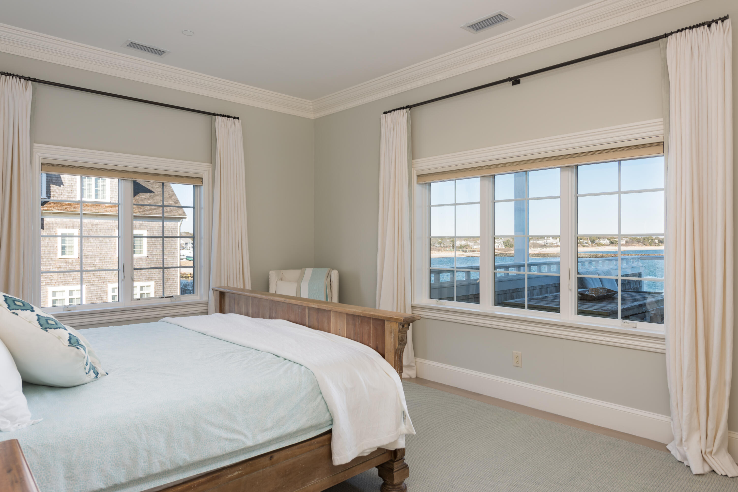 23 Snow Inn Road, Unit 2 Harwich Port, MA 02646 - Photo 36 of 40 a bedroom with a bed and a large window