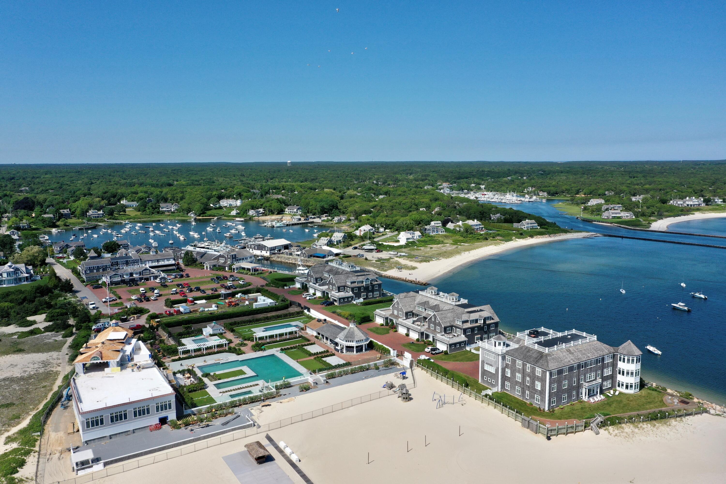 23 Snow Inn Road, Unit 2 Harwich Port, MA 02646 - Photo 5 of 40 an aerial view of a city with lots of residential buildings and ocean view in back