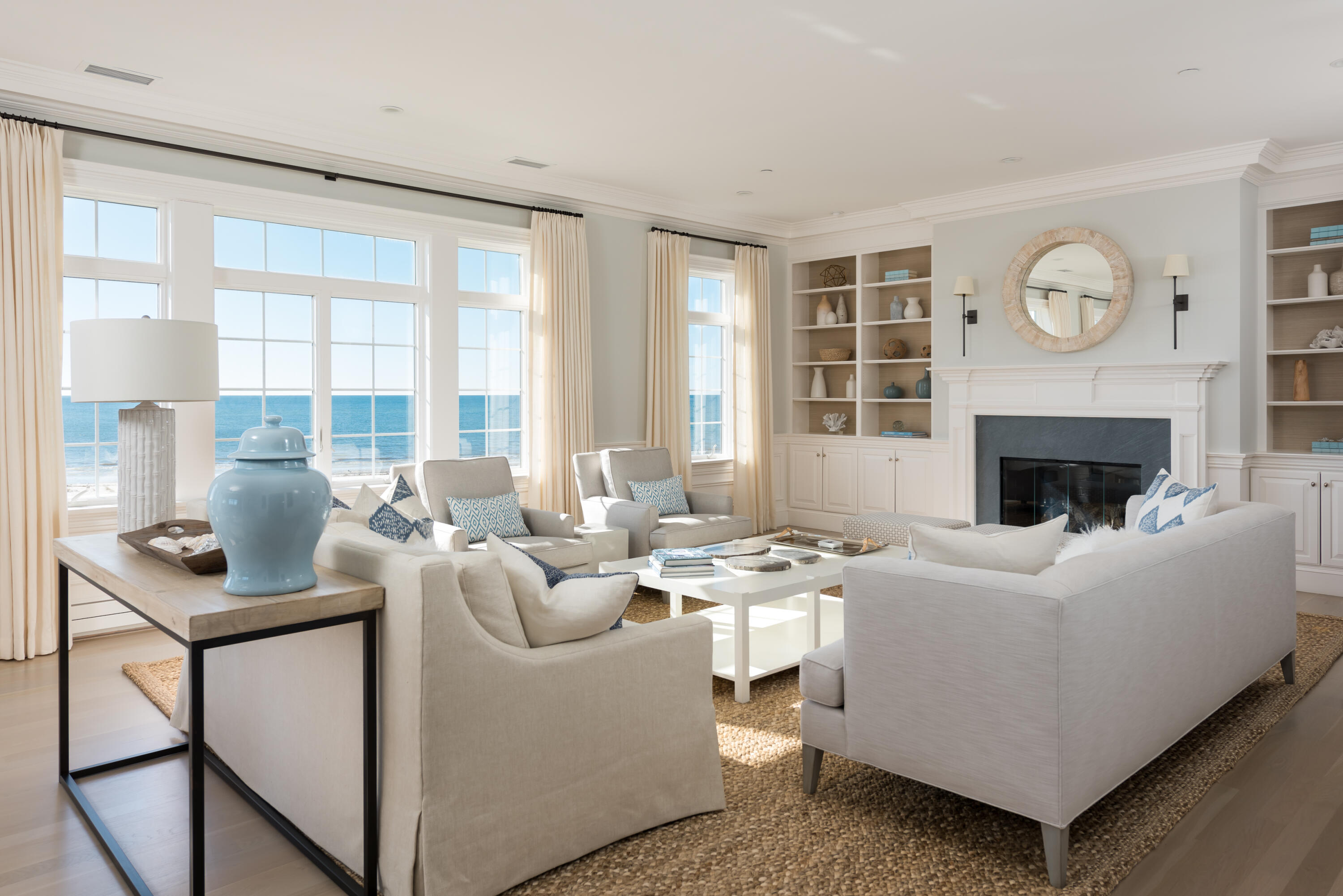 23 Snow Inn Road, Unit 2 Harwich Port, MA 02646 - Photo 9 of 40 a living room with furniture a fireplace and a large window