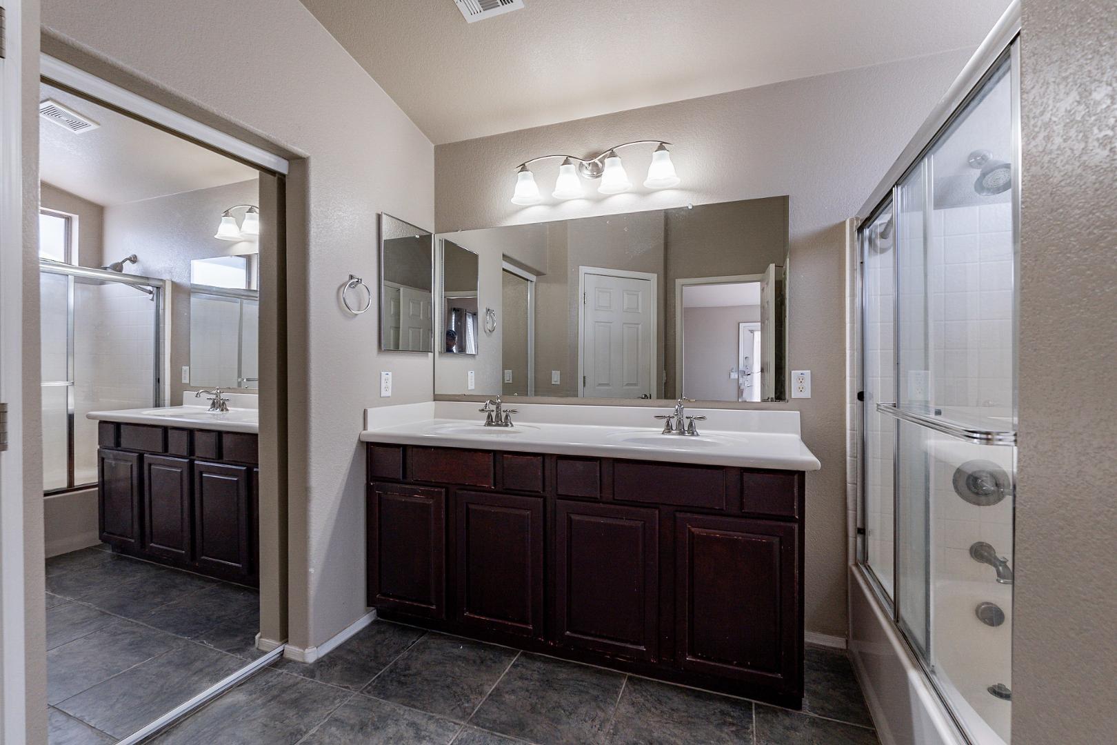 3713 East Utopia Road Phoenix, AZ 85050 - Photo 26 of 47 a bathroom with a double vanity sink mirror and double