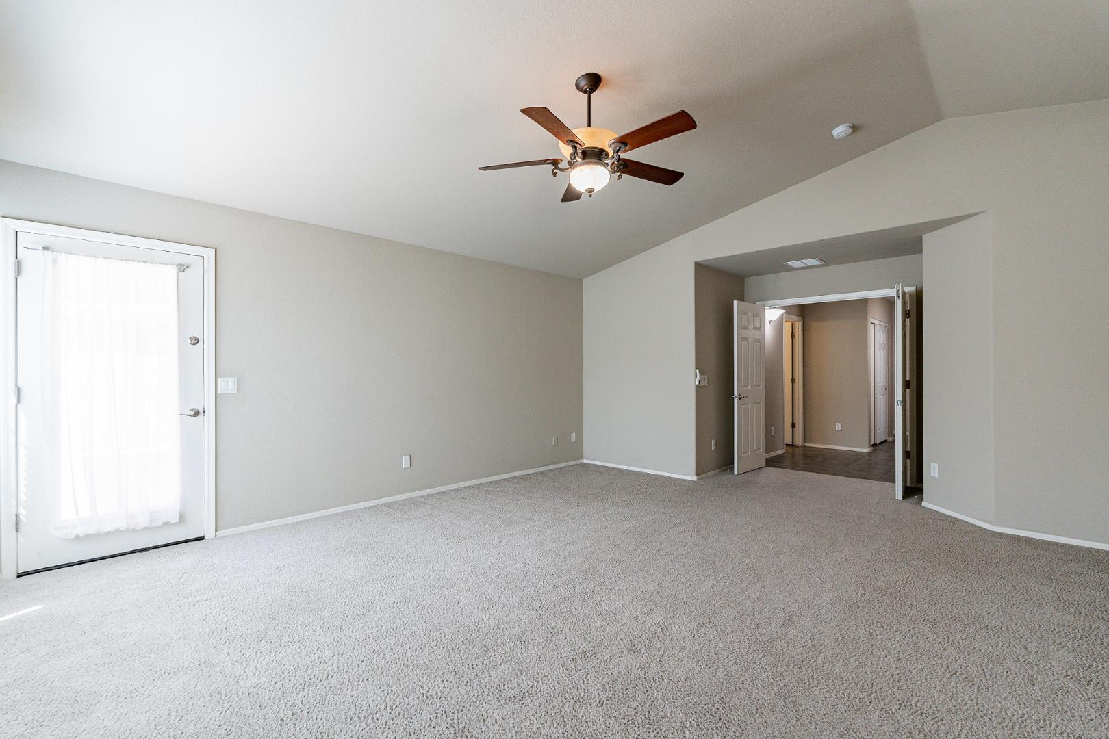 3713 East Utopia Road Phoenix, AZ 85050 - Photo 34 of 47 a view of a livingroom with a ceiling fan and window