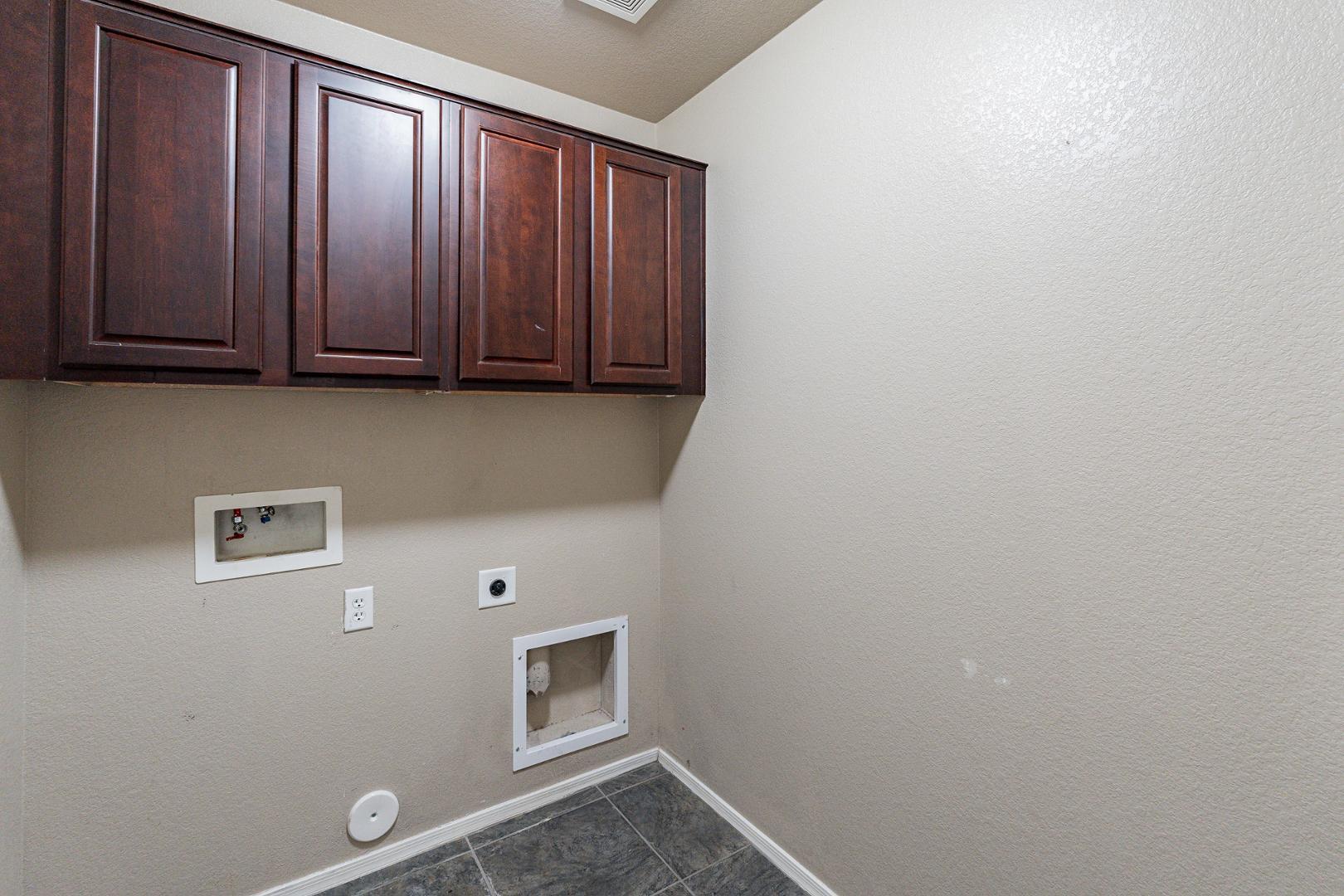 3713 East Utopia Road Phoenix, AZ 85050 - Photo 35 of 47 a view of room with wooden floor and cabinet