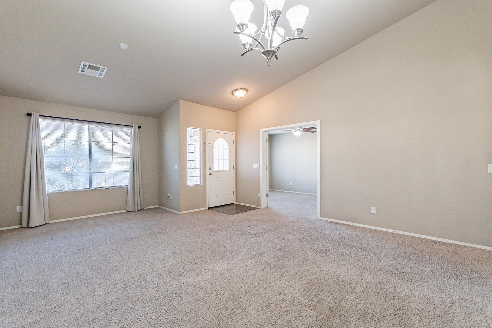 3713 East Utopia Road Phoenix, AZ 85050 - Photo 4 of 47 a view of an empty room with a window