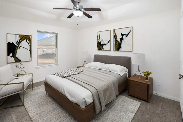 a bedroom with a bed wooden floor and window