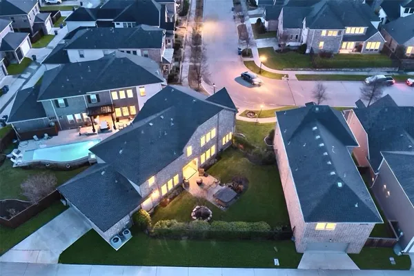 an aerial view of a house with yard swimming pool and outdoor seating