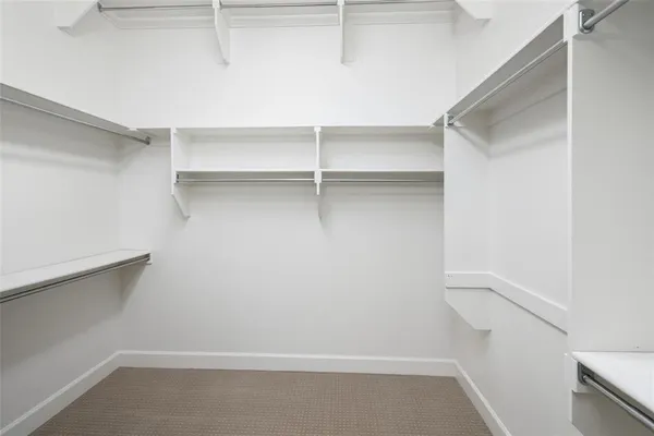 a view of an empty walk in closet