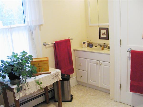 93 Bridge Road Northampton, MA 01062 - Photo 13 of 13 a bathroom with a tub sink and a mirror