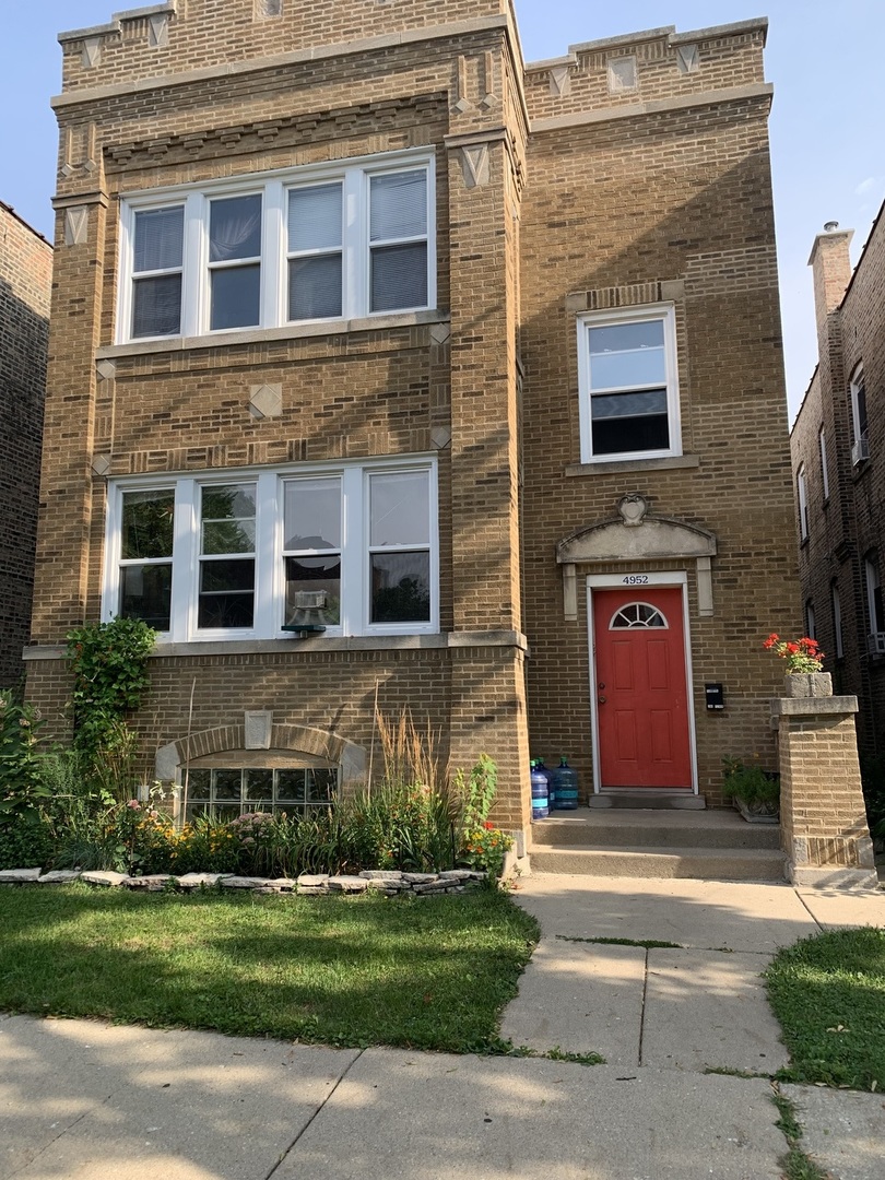 4952 West Patterson Avenue Chicago, IL 60641 - Photo 1 of 1 a front view of a house with garden