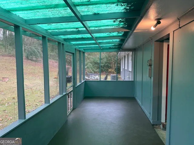 a view of room with window and entryway