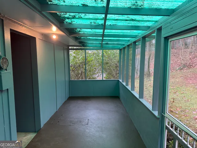 a view of room with window and a porch