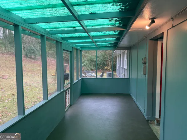 a view of room with window and entryway