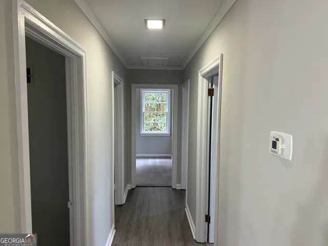 a view of entryway with wooden floor