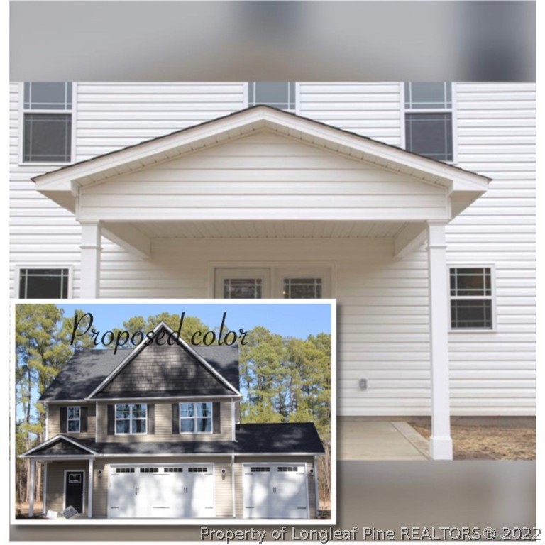 1319 Reservation Road Aberdeen, NC 28315 - Photo 2 of 6 a front view of a house with garage