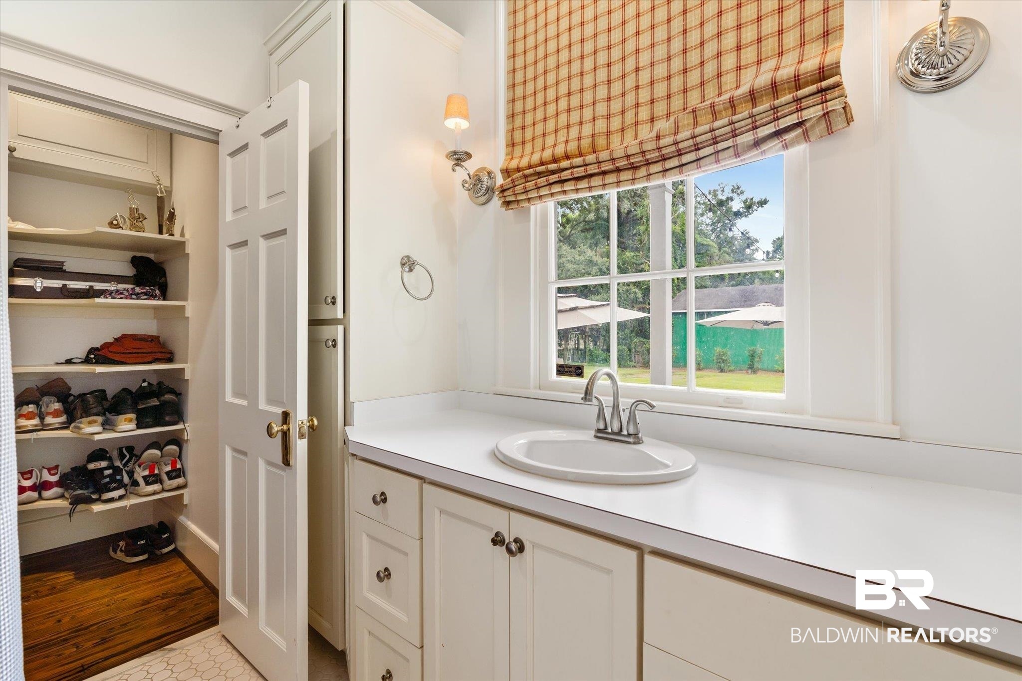 2205 Spring Hill Avenue Mobile, AL 36607 - Photo 34 of 59 Bathroom with vanity, hardwood / wood-style flooring, and a healthy amount of sunlight