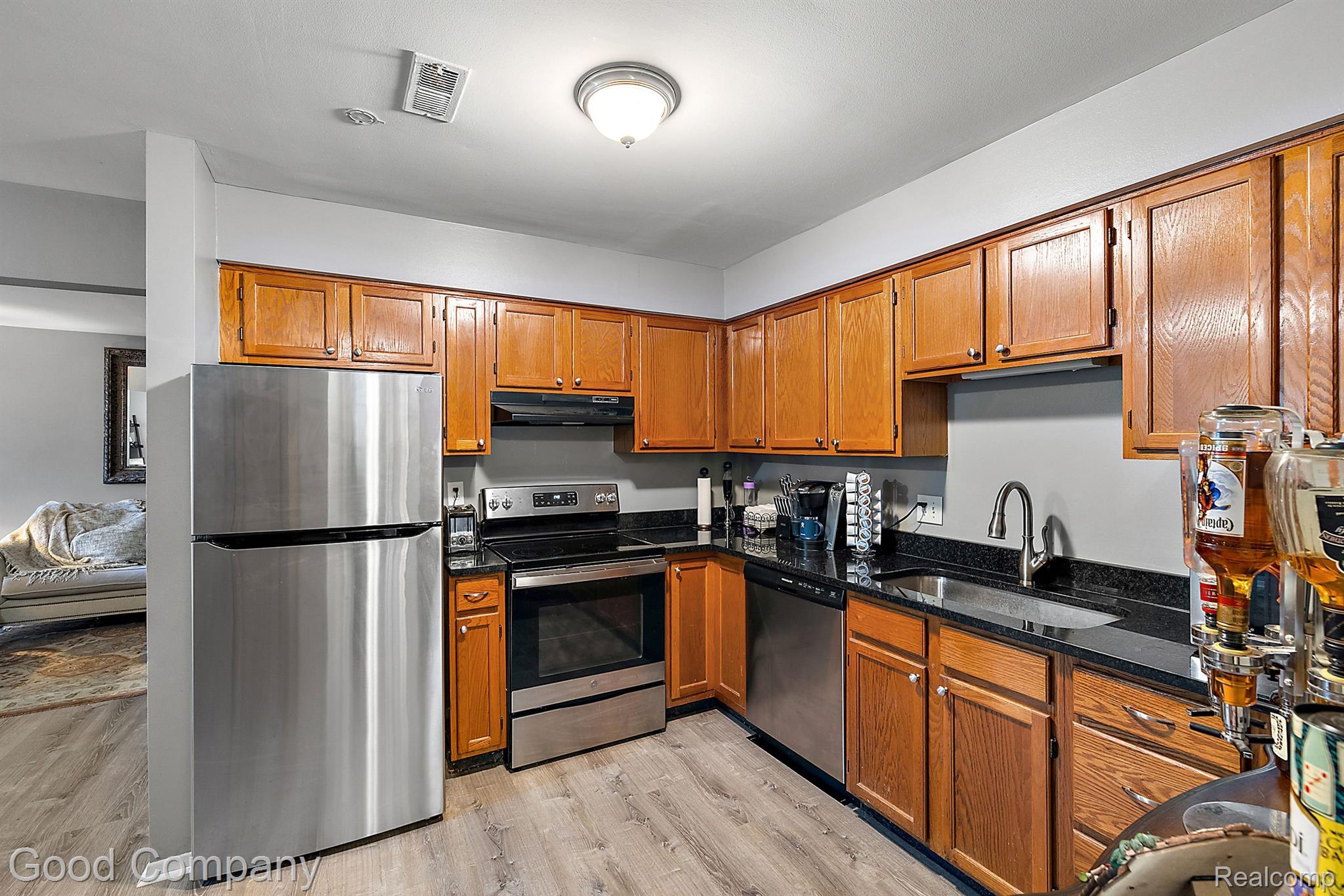 440 Baldwin Avenue, Unit 56 Rochester, MI 48307 - Photo 6 of 13 Open Kitchen, granite counter tops