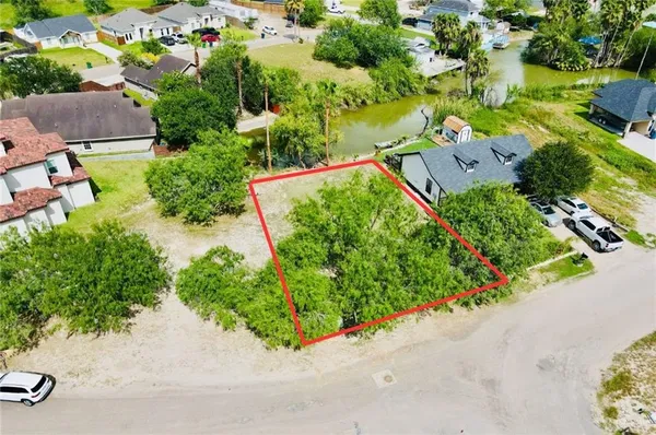 an aerial view of a house with a yard and garden