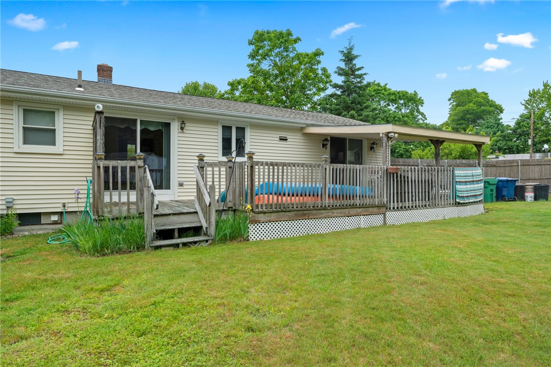 198 Lucas Road Warwick, RI 02818 - Photo 4 of 22 A large deck with an entrance from the dining area and a covered porch with an entrance from the family room