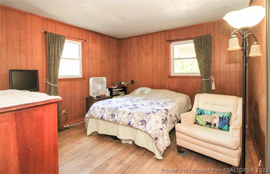 85 McIntyre Road Pinehurst, NC 28374 - Photo 11 of 20 a bedroom with a bed and a window