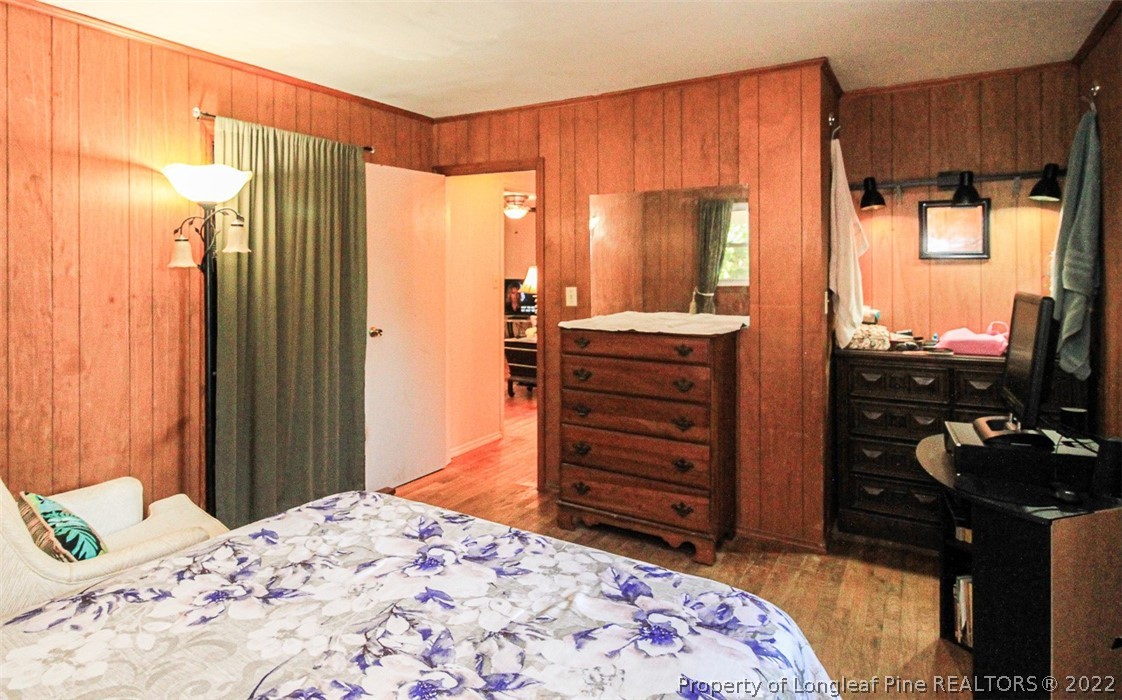 85 McIntyre Road Pinehurst, NC 28374 - Photo 13 of 20 a bedroom with a bed and furniture