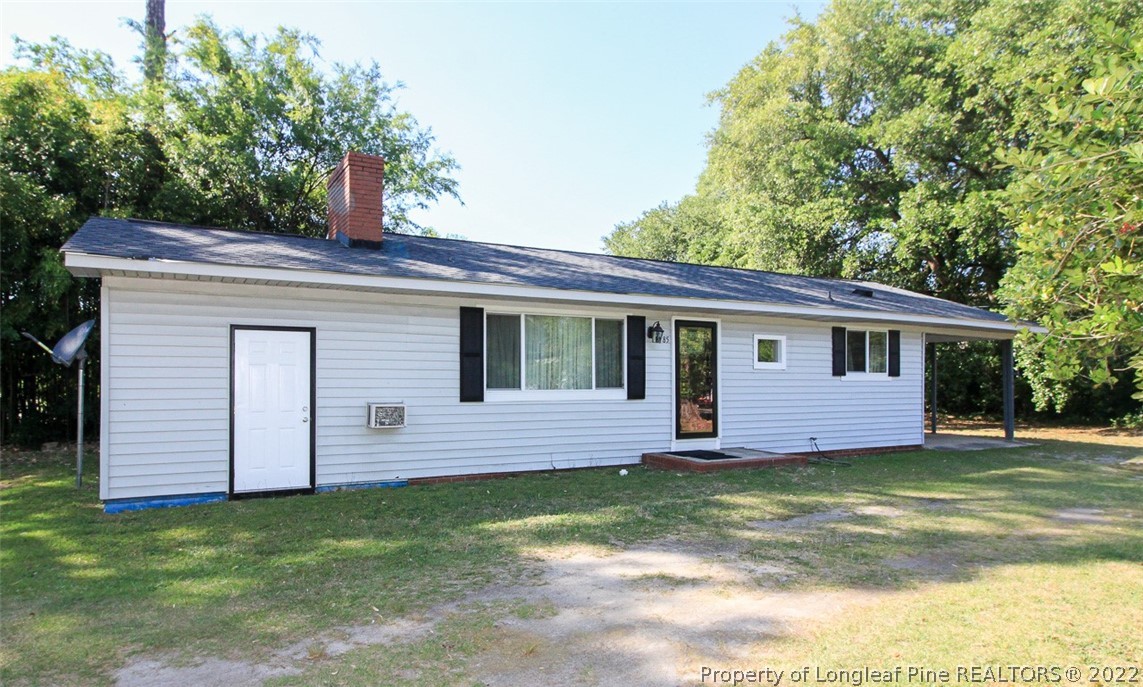 85 McIntyre Road Pinehurst, NC 28374 - Photo 2 of 20 a view of a house with a backyard