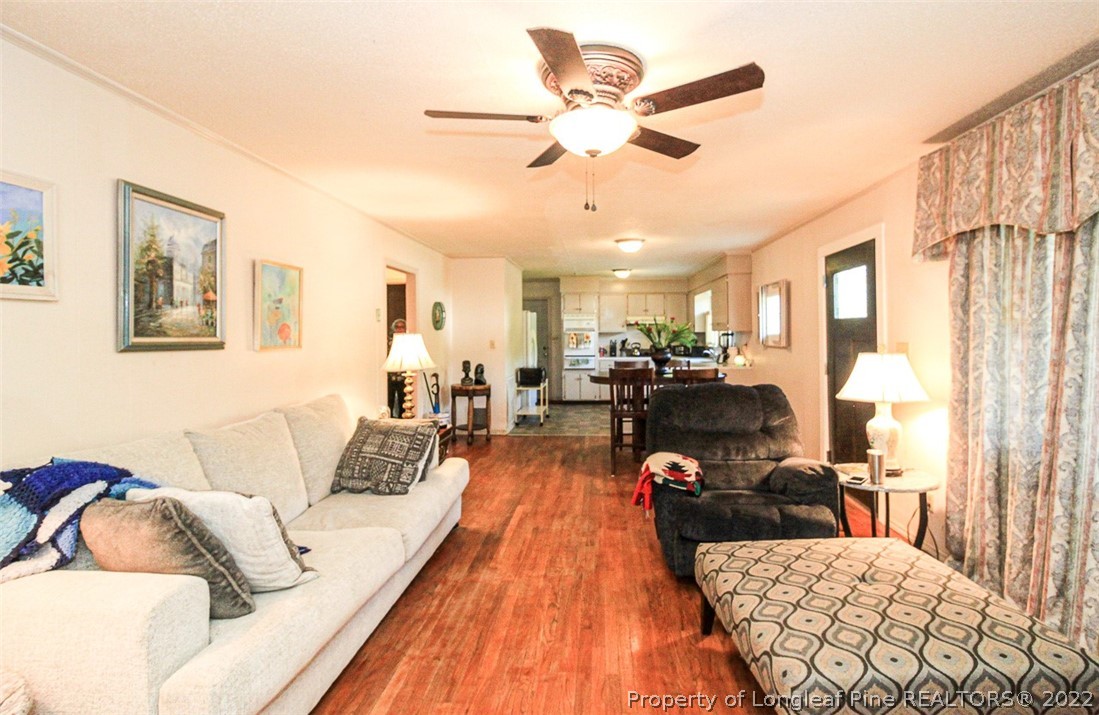 85 McIntyre Road Pinehurst, NC 28374 - Photo 4 of 20 a living room with furniture and a wooden floor
