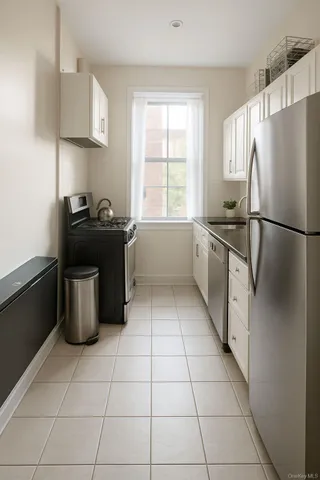 a kitchen with a stove a refrigerator and a sink