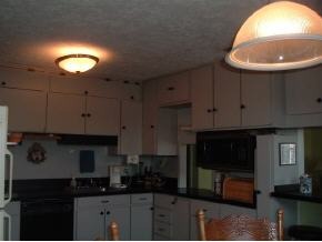 2568 Post Road Melbourne, FL 32935 - Photo 5 of 8 a kitchen with cabinets a sink and a stove