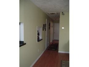 2568 Post Road Melbourne, FL 32935 - Photo 6 of 8 a view of a hallway with wooden floor