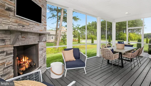 a living room with fireplace furniture and a flat screen tv