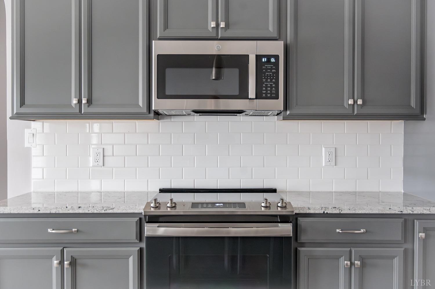 1051 Wills Way Forest, VA 24551 - Photo 14 of 49 a stove top oven sitting inside of a kitchen