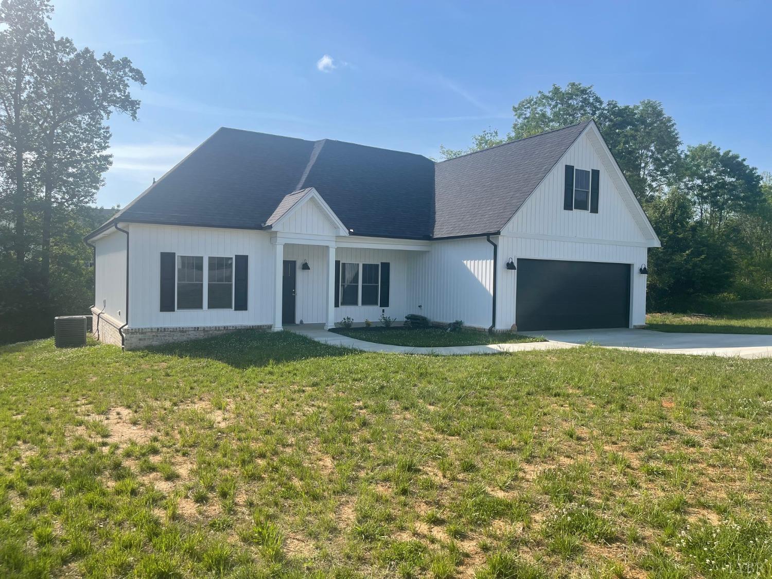 1051 Wills Way Forest, VA 24551 - Photo 17 of 49 a front view of a house with a garden