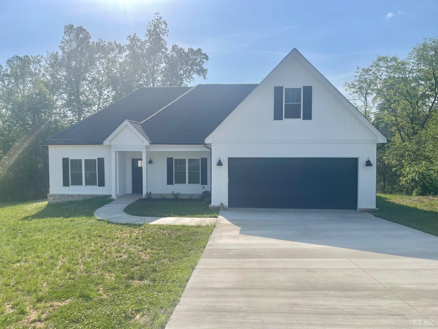 1051 Wills Way Forest, VA 24551 - Photo 18 of 49 a front view of a house with garden