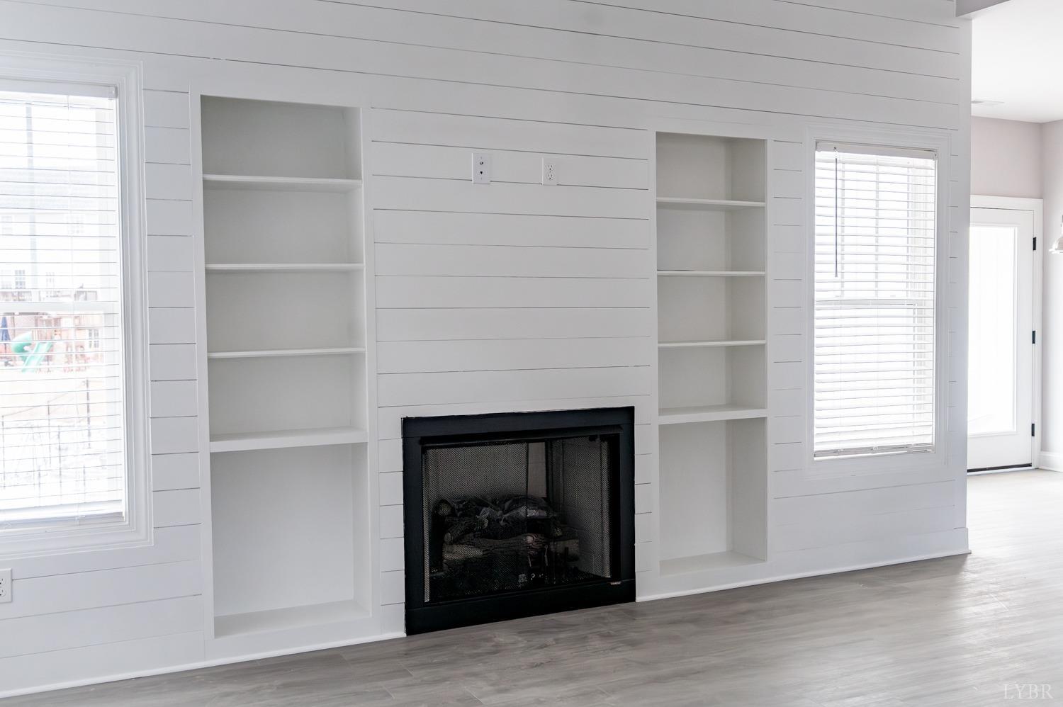 1051 Wills Way Forest, VA 24551 - Photo 26 of 49 a living room with a fireplace and a window