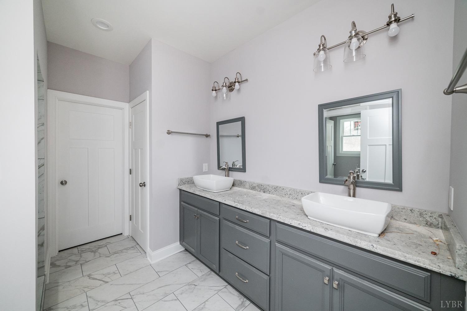 1051 Wills Way Forest, VA 24551 - Photo 34 of 49 a bathroom with a granite countertop sink and a mirror
