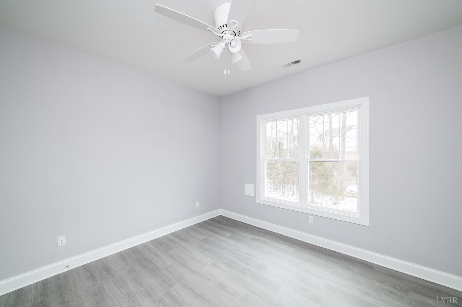 1051 Wills Way Forest, VA 24551 - Photo 38 of 49 an empty room with a window and a fan
