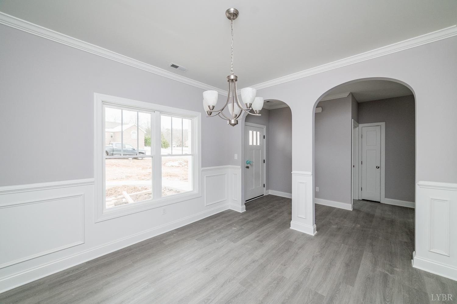 1051 Wills Way Forest, VA 24551 - Photo 9 of 49 a view of a room with wooden floors and chandelier
