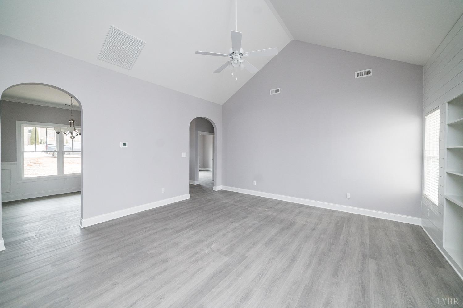 1051 Wills Way Forest, VA 24551 - Photo 10 of 49 an empty room with wooden floor and windows
