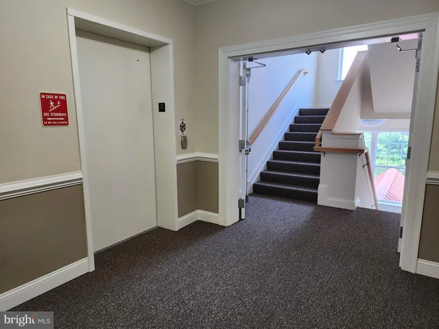 a view of a hallway with staircase